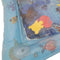 A close up view of the blue inflatable water mat with foam toys. The mat has a sea-life theme.