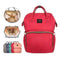 A red backpack nappy bag. It also shows images of the bag inside and other colours available.