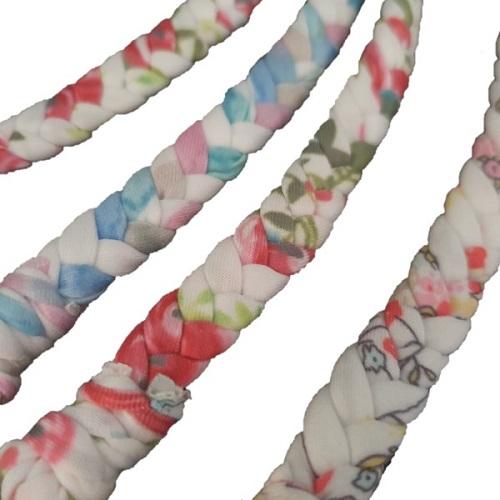 A close up image of the 4 assorted braided pacifier clips with a floral pattern.