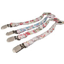 There are 4 assorted braided pacifier clips with a floral pattern in a row. All the pacifier clips have metal brace clips.