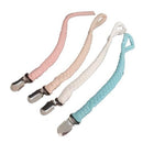 There are 4 braided pacifier clips in pink, beige, white and blue. Each pacifier clip has a metal brace clip attached.