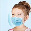 A little girl wearing a blue disposable mask.