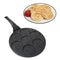 Emoji Frying Pan. With crumpets on a plate.